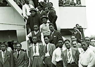 Jamaican men,  many of them former RAF servicemen, disembark Empire Windrush at Tilbury Docks, 22 June 1948.