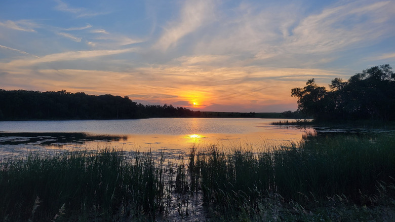 The sun setting over Roy Lake