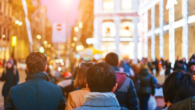 people crowd walking on busy street