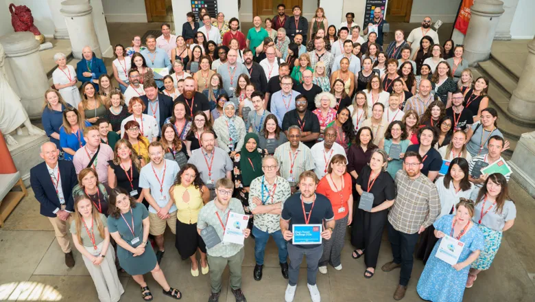 A group of people holding awards and smiling.