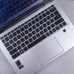 an open laptop computer sitting on top of a table