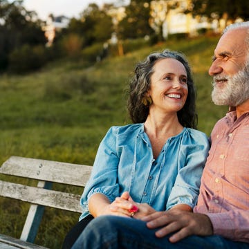 Man and woman on bench, smiling Man and woman on bench, smiling