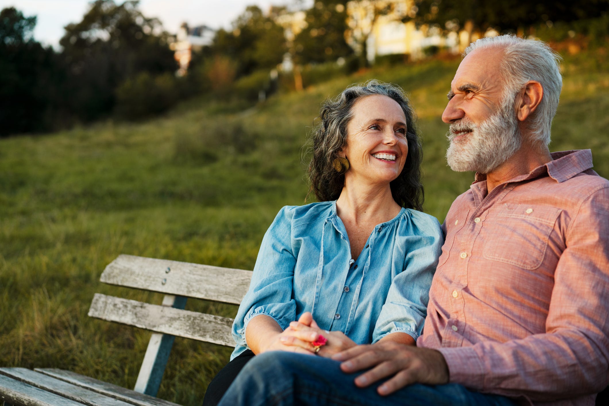 Man and woman on bench, smiling Man and woman on bench, smiling