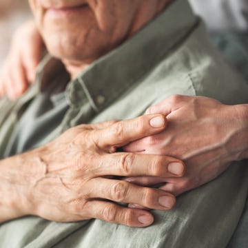 Comforting hand supporting the old man types of dementia - Comforting hand supporting the old man