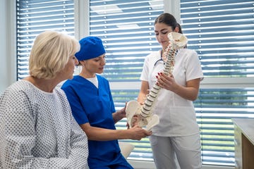 Female surgeon in hospital talking to patient before surgery Female surgeon in hospital talking to patient before surgery