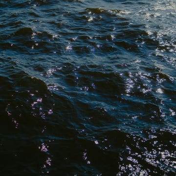 sunlight sparkling on dark blue ocean waves. sunlight sparkling on dark blue ocean waves.