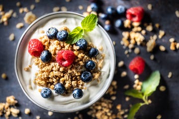 Yogurt bowl with muesli, raspberries and blueberries. A healthy breakfast or snack, rich in protein, fiber and calcium. Healthy diet and lifestyle concept. high protein foods