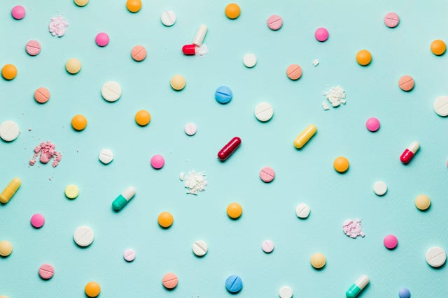 pills on blue background pills on blue background