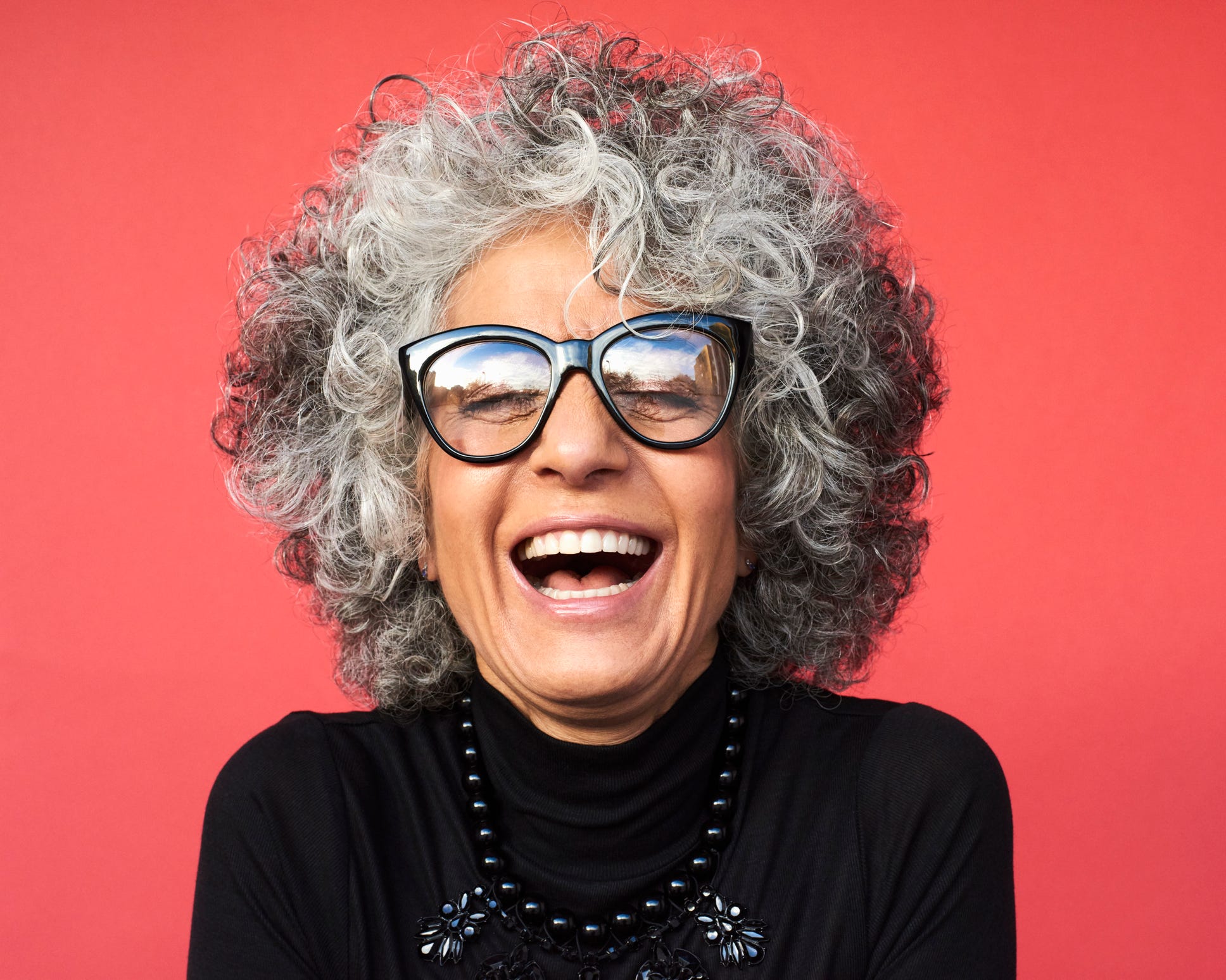 how to look younger Portrait of mature woman laughing how to look younger portrait of mature woman laughing