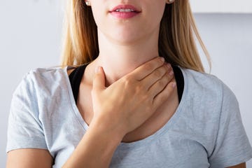 Woman Having Sore Throat causes of swollen tonsils