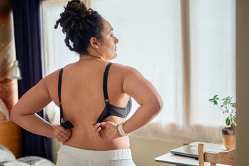 A young woman wearing her bra in the bedroom a young woman wearing her bra in the bedroom