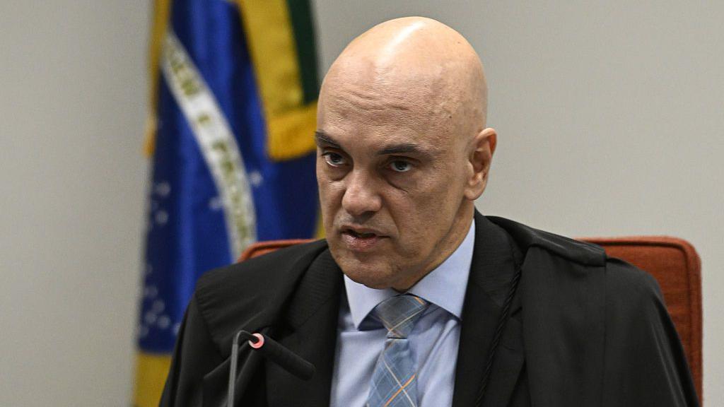 Brazilian Supreme Court Judge Alexandre de Moraes speaks during hearings involving former Brazilian President Jair Bolsonaro and his associates accused of attempting a coup d'etat in January 2023, in Brasilia, on June 9, 2025.