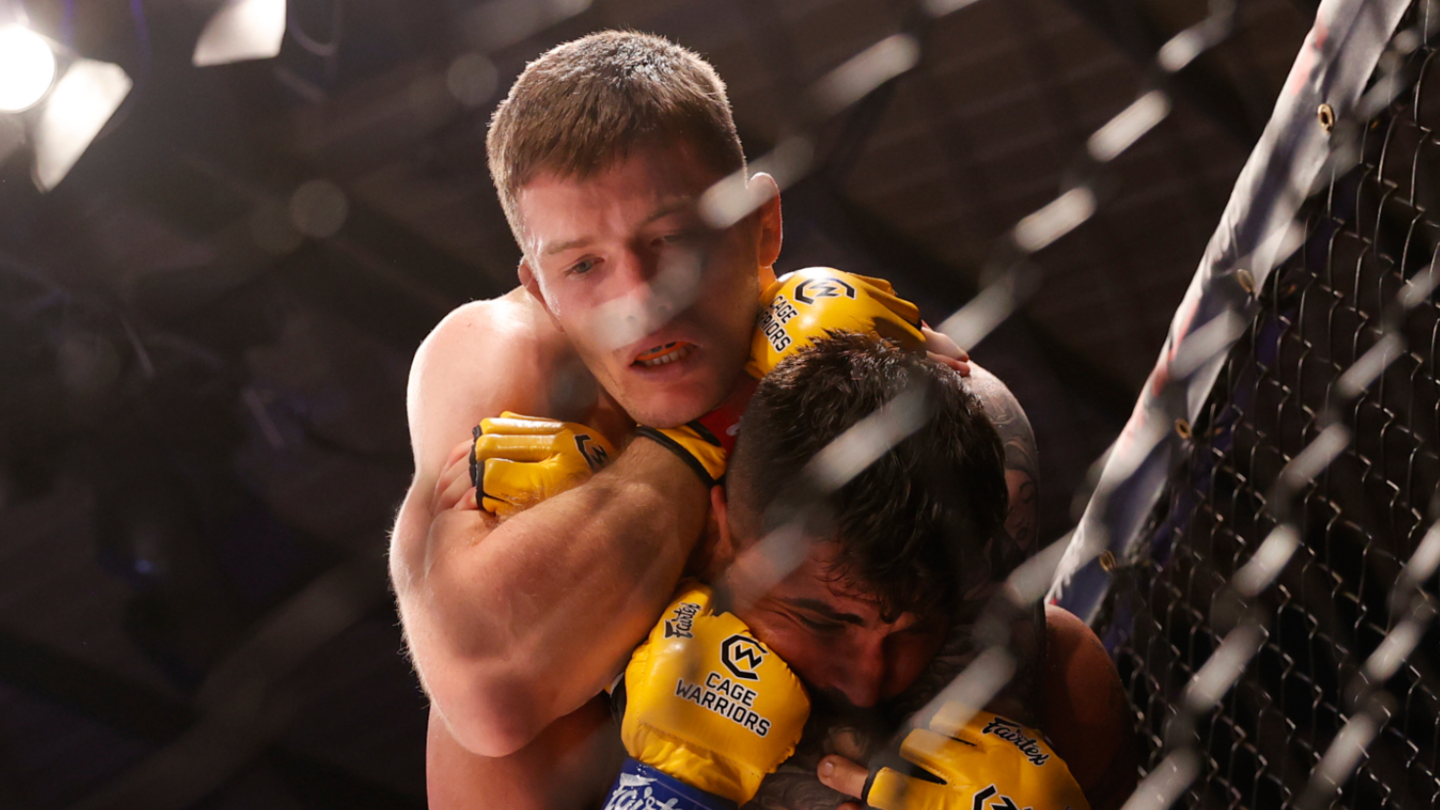 Ieaun Davies performs a rear naked choke submission hold