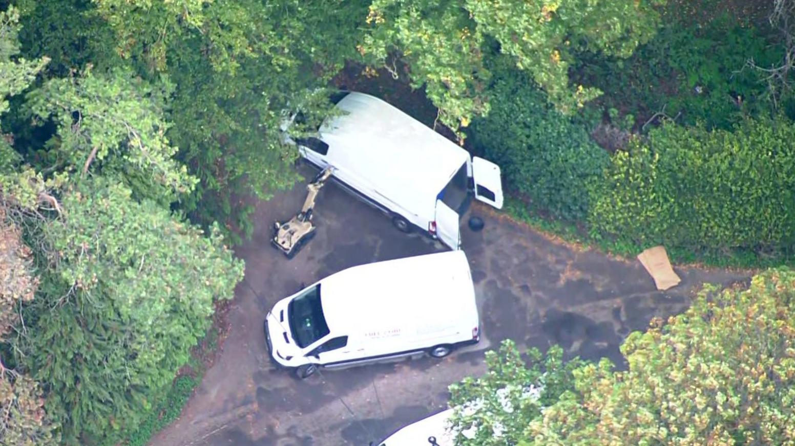 Aerial footage of robot and white vans near RAF Fairford.