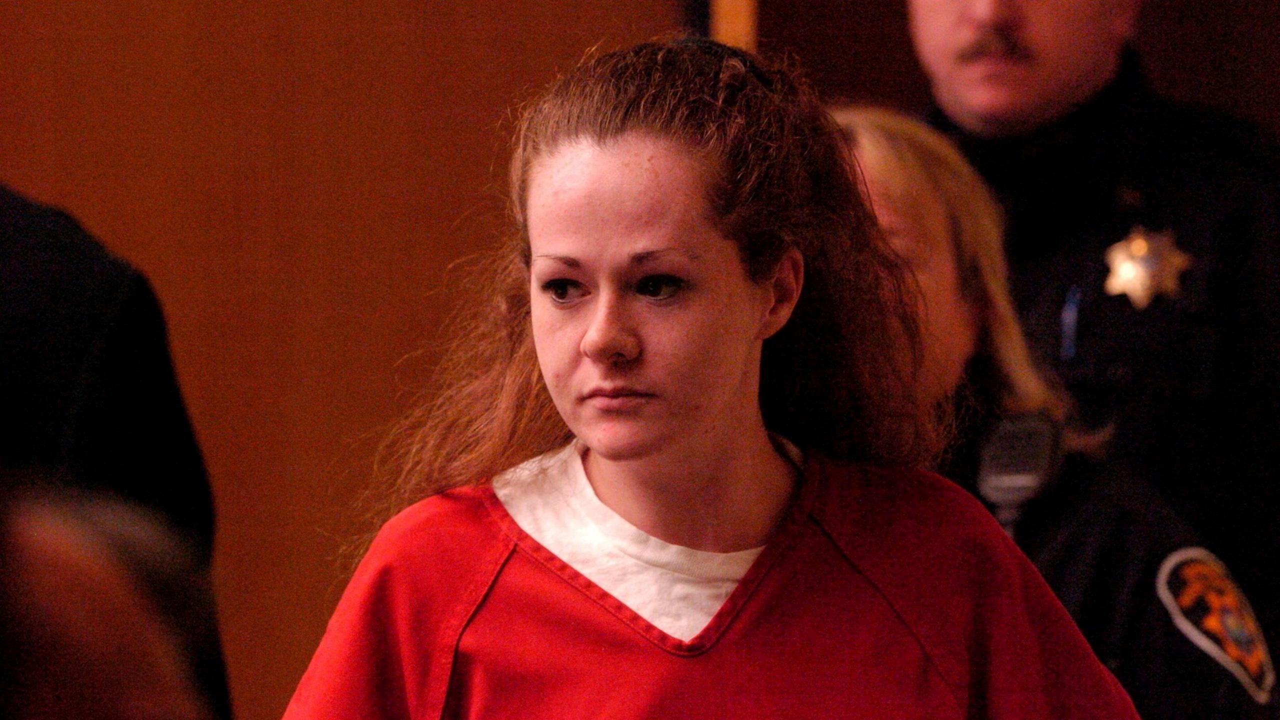 A picture taken on December 4, 2007 shows death row inmate Christa Pike entering a Knox County Criminal Court in Knoxville, Tennessee, US. Pike wears a red prison scrubs and a white t-shirt. She has brown eyes and brown hair.