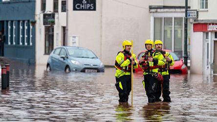Recovery workers seen in flooded water