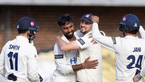 Warwickshire celebrate taking a wicket
