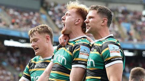 Fraser Dingwall, George Hendy and Fin Smith celebrate Hendy's try during Saturday's final
