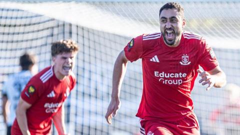 Hussein Mehasseb celebrates after scoring a late goal for Connah's Quay