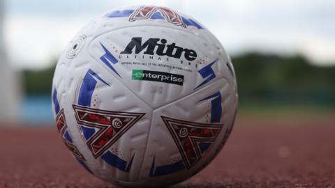 National League football on an athletics track