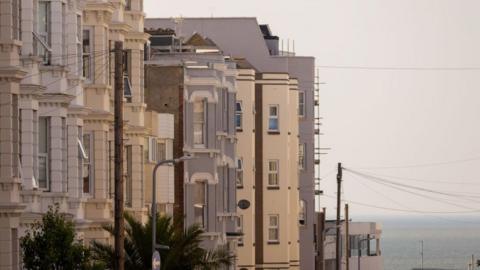 A terrace of homes and holiday lets in the Cliftonville area of Margate. The sea can be seen in the distance.