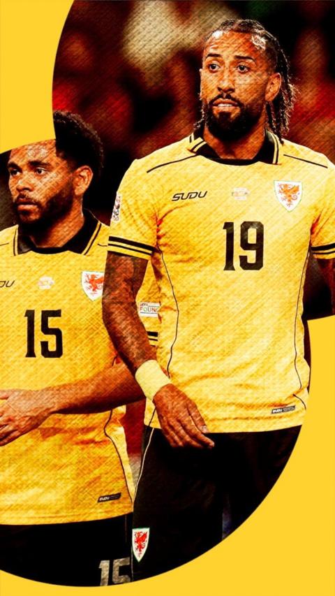 Wales' Sorba Thomas and Jay Dasilva pictured in a yellow away shirt