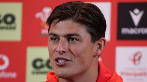Louis Rees-Zammit talks to the press