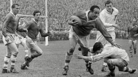 Billy Boston (Wigan) is tackled by Holliday Don Fox (Wakefield) in the 1960 Northern Rugby League Championship Cup Final