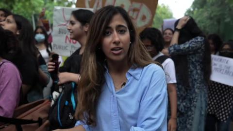 Azadeh Moshiri in a group of protesting women on a street in Delhi