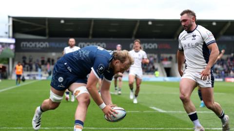 Sale second row Ben Bamber about to put the ball down for his side's second try with Bristol full-back Rich Lane watching on