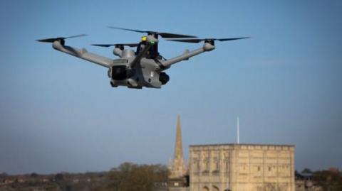 A Police drone flying across Norwich with the castle in the background