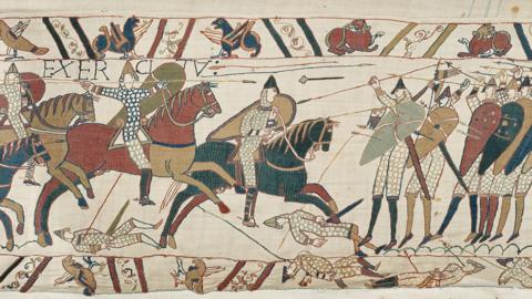 A section of the Bayeux Tapestry showing men riding horses and arrows being fired