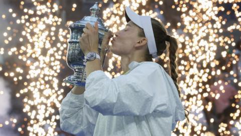 Elena Rybakina kisses the US Open trophy