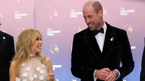 The Prince of Wales and Kylie Minogue walk together as they attend the fifth annual Earthshot Prize Awards Ceremony at the Museum of Tomorrow in Rio de Janeiro, on day three of his visit to Brazil on 5 November 2025
