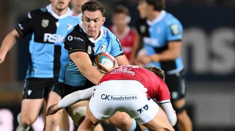 Taine Basham carries the ball into contact