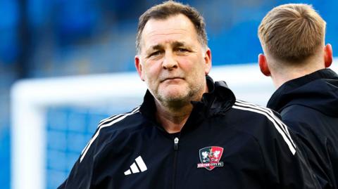 Kevin Miller wearing a black tracksuit top during his time on Exeter City's coaching staff