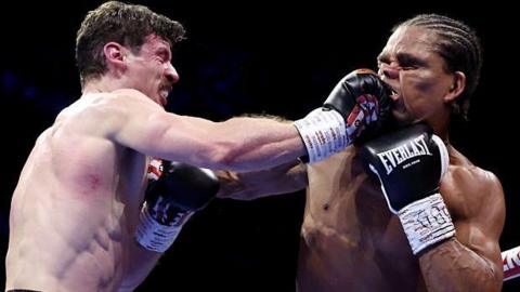 Nathan Heaney punches Gerome Warburton during their bout in March 2026