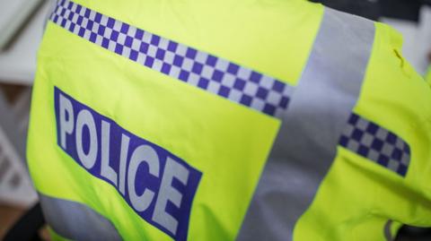 A stock image of a police officer's fluorescent jacket.