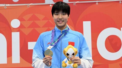Yu Zidi of China wins gold medal after competing in the Women's 200m butterfly final on day one of the 20th Asian Games
