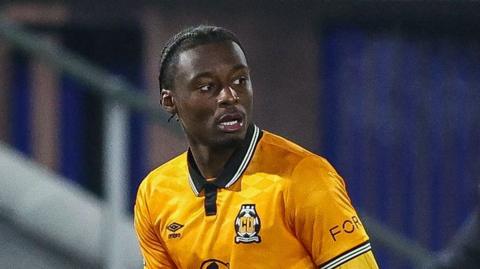 Jubril Okedina in action for Cambridge United