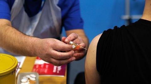 A student receives the Meningitis B vaccine in Kent.