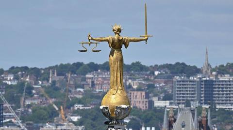 The statue of Lady Justice atop the Old Bailey in London