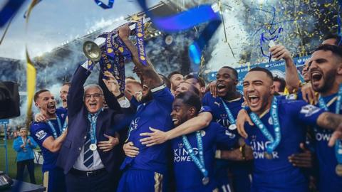 Leicester City celebrate with the Premier League trophy