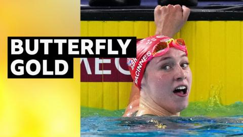 Keanna Macinnes looks backwards immediately after finishing her swim