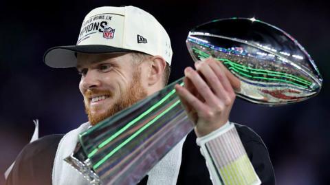 Sam Darnold holds the Lombardi Trophy after the Seattle Seahawks win Super Bowl 60