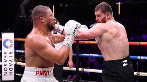Johnny Fisher lands a punch on Michael Pirotton