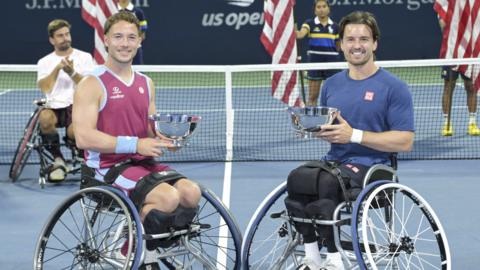 Alfie Hewett and Gordon Reid hold the US Open men's wheelchair doubles trophies