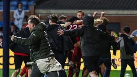 Aberdeen fans spill on to the pitch at Rugby Park