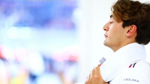 George Russell of Great Britain and Mercedes looks on from the drivers parade prior to the F1 Grand Prix of Qatar