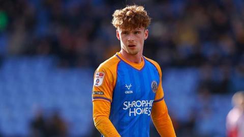 Tommy McDermott playing for Shrewsbury Town last season